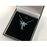A 14ct white gold blue topaz pendant on 18ct white gold chain, 19.88 mm x 22.42 mm pendant size.