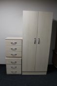 A double door wardrobe and pair of matching three drawer chests