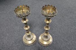 A pair of brass Gothic style church candlesticks, height 47 cm.