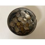 A tin of pre decimal British coins,