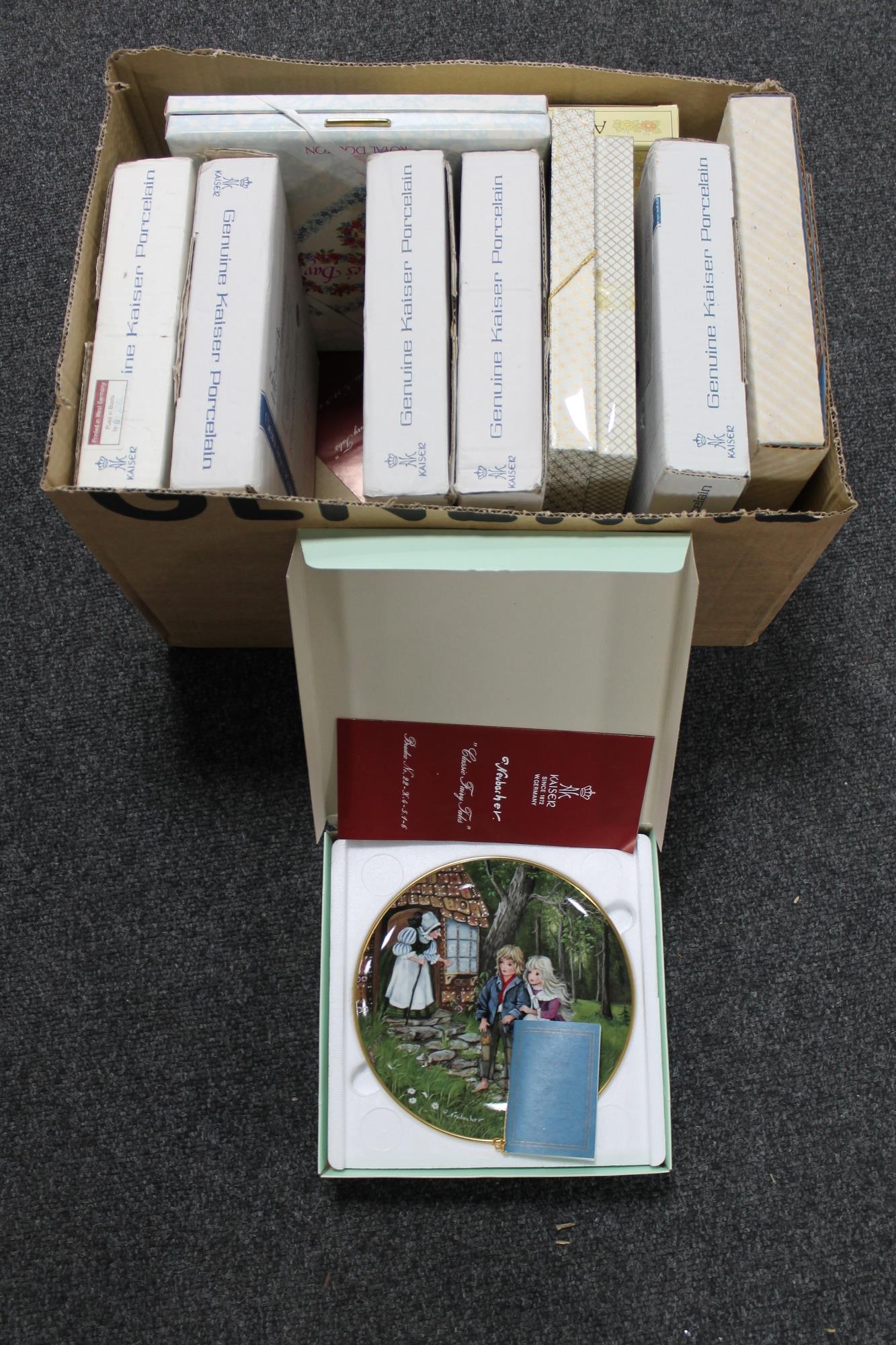 A box of ten boxed collector's plates,