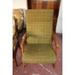 A mid century teak framed high backed armchair