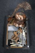 A box of copper Gladiator style helmet, carved wooden animal figures,