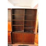 A mid century Danish bookcase with cupboards beneath