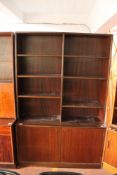 A mid century Danish bookcase with cupboards beneath