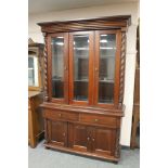 A reproduction mahogany bookcase with glazed doors,