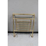 A brass heated towel rail CONDITION REPORT: 81 cm wide x 93.5 cm height.