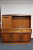 A teak G Plan triple door cocktail sideboard