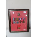 A framed group of five WWII medals with 'The Welsh' cap badge