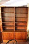 A mid century Danish bookcase with cupboards beneath