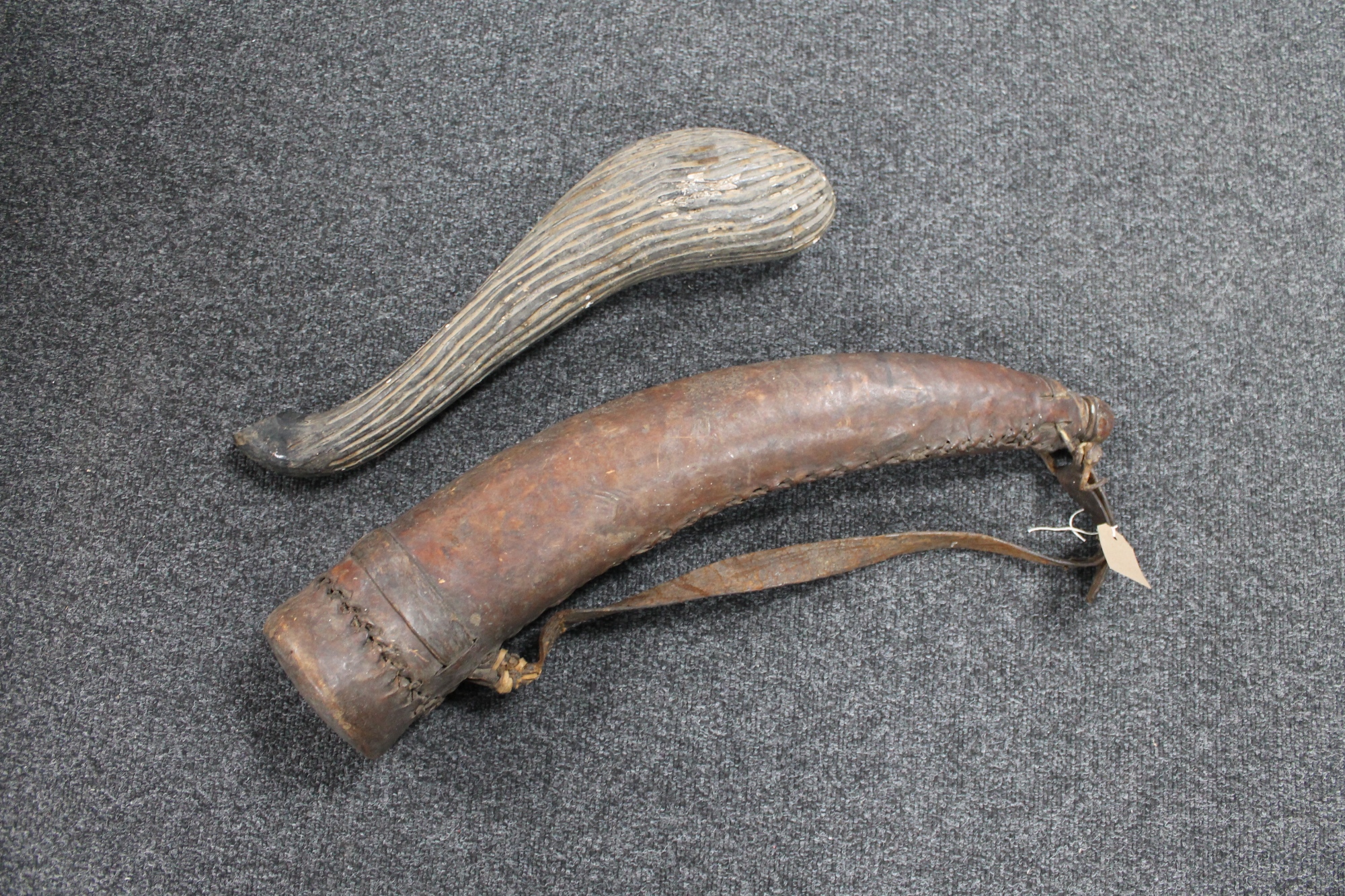 An antique African leather-covered buffalo drinking horn,