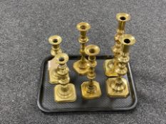 Three pairs of antique brass candlesticks