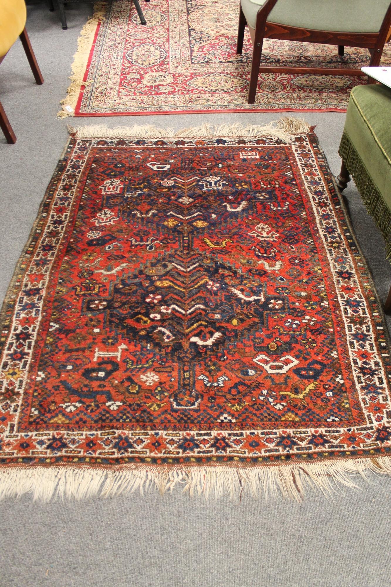 A fringed Persian carpet