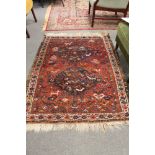 A fringed Persian carpet