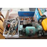 An industrial electric table grinder, a box of tools,