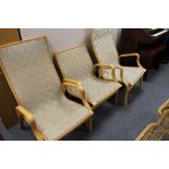 A set of three mid century beech armchairs