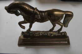 A 19th century brass shire horse door stop