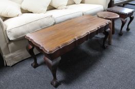 A mahogany coffee table together with a lamp table and a stool