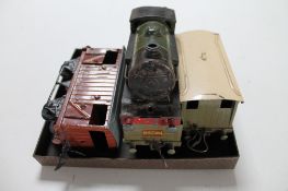 A tin plated clockwork train with carriages