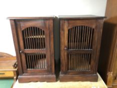 A pair of Eastern hardwood bedside cabinets