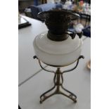 A vintage brass and glass oil lamp