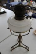 A vintage brass and glass oil lamp