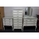 Three pieces of cream bedroom furniture comprising of two three-drawer chests and an eight-drawer