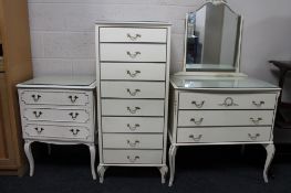 Three pieces of cream bedroom furniture comprising of two three-drawer chests and an eight-drawer