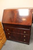 A reproduction mahogany bureau