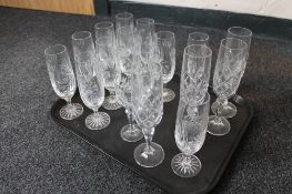 A tray of cut crystal and glass champagne flutes