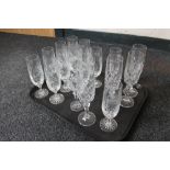 A tray of cut crystal and glass champagne flutes