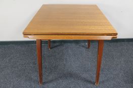 A mid 20th century pull out dining table