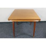 A mid 20th century pull out dining table