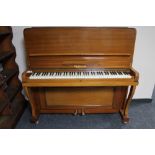 A mahogany cased upright piano by Schonberg