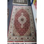 A Tabriz design rug,