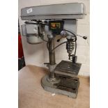 An electric bench drill