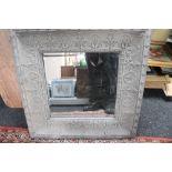 A decorative metal framed mirror