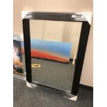 A black ribbed mirror