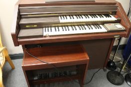 An electric GEM organ with stool