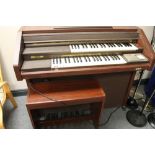 An electric GEM organ with stool