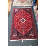 A Persian Khamseh rug,