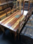 A sheesham wood dining room table and five chairs,