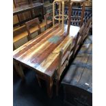 A sheesham wood dining room table and five chairs,