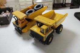 Two Tonka trucks