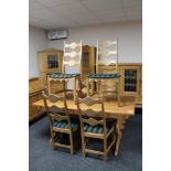 A blonde oak refectory dining table and six chairs