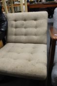 A mid century upholstered lounge chair