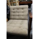 A mid century upholstered lounge chair