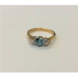 An 18ct gold blue zircon and diamond ring
