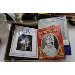 A box of vintage commemorative coronation books,