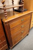 An Edwardian mahogany four drawer chest